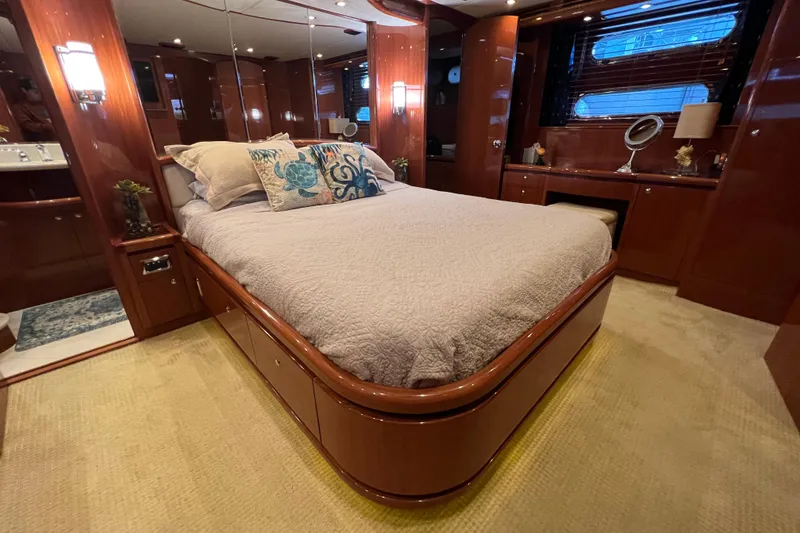 Slide: The Image of Luxurious bedroom interior of 2012 Hampton motor yacht with elegant wood finishes. - 24