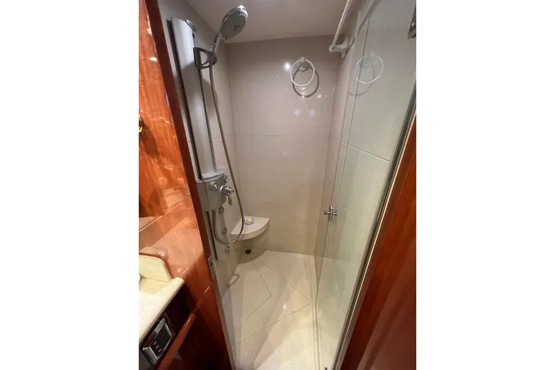 Slide: The Image of Luxurious shower in 2012 Hampton motor yacht with glass door and modern fixtures. - 28