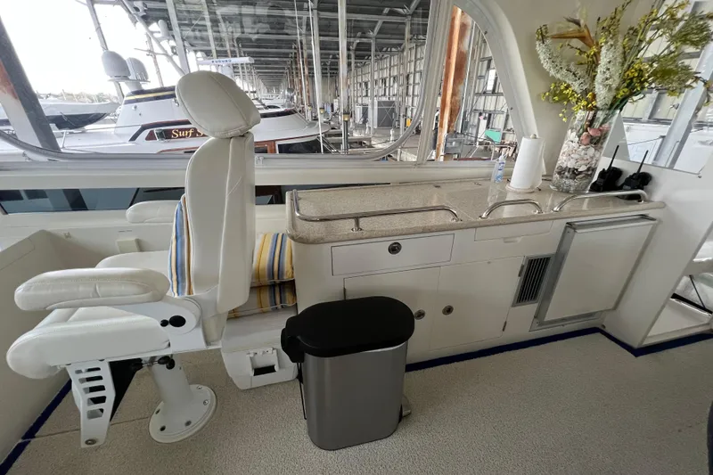 Slide: The Image of Interior of a 2012 Hampton Motor Yacht with a sleek helm and modern amenities. - 37