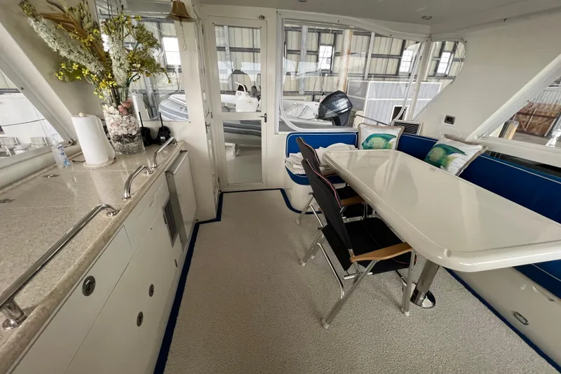 Slide: The Image of Luxurious 2012 Hampton motor yacht interior with dining area and modern amenities. - 38