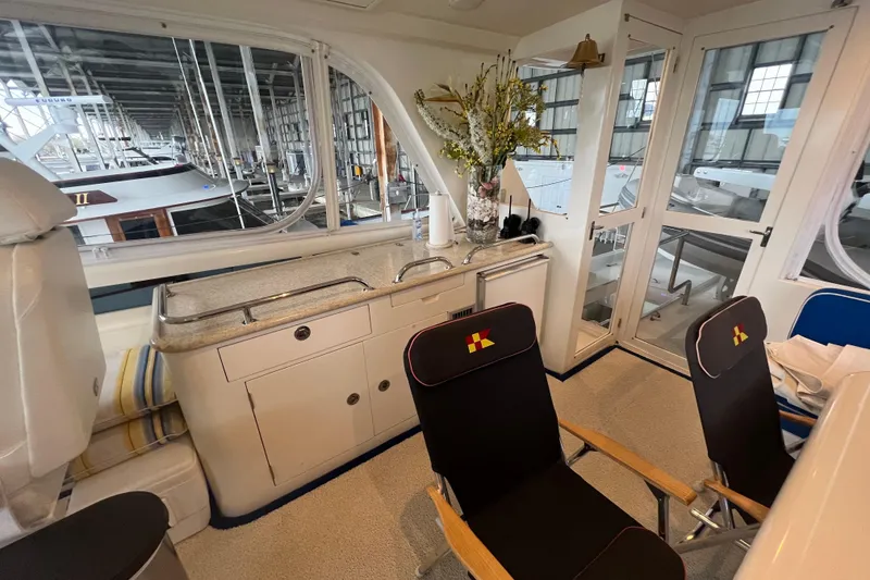 Slide: The Image of Luxurious 2012 Hampton motor yacht interior with kitchenette and seating area. - 39