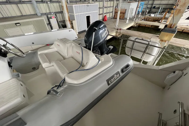 Slide: The Image of 2012 Hampton motor yacht with Caribe inflatable boat and Yamaha engine in marina. - 41