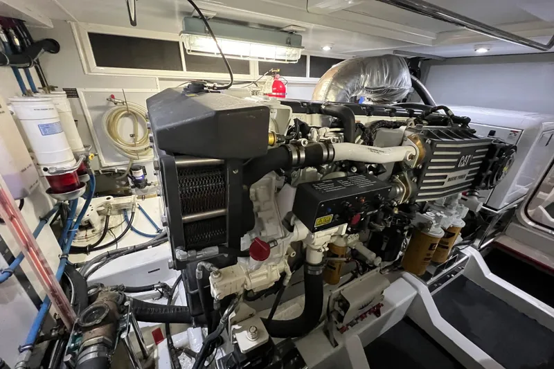 Slide: The Image of Engine room of a 2012 Hampton Motor Yacht, featuring a CAT marine engine. - 42