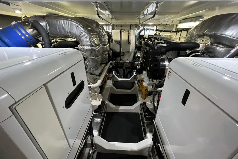 Slide: The Image of Engine room of a 2012 Hampton motor yacht, showcasing machinery and equipment. - 43