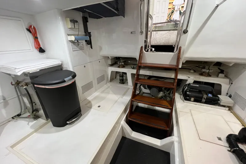 Slide: The Image of Engine room of 2012 Hampton motor yacht with wooden stairs and equipment. - 44
