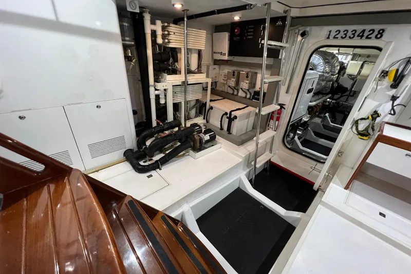 Slide: The Image of Engine room of a 2012 Hampton motor yacht, showcasing equipment and machinery. - 45