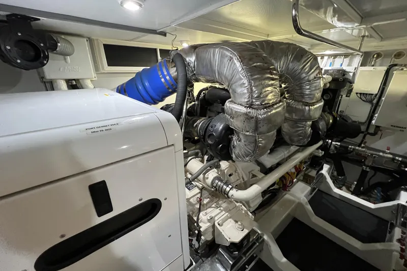 Slide: The Image of Engine room of a 2012 Hampton motor yacht, showcasing machinery and components. - 49