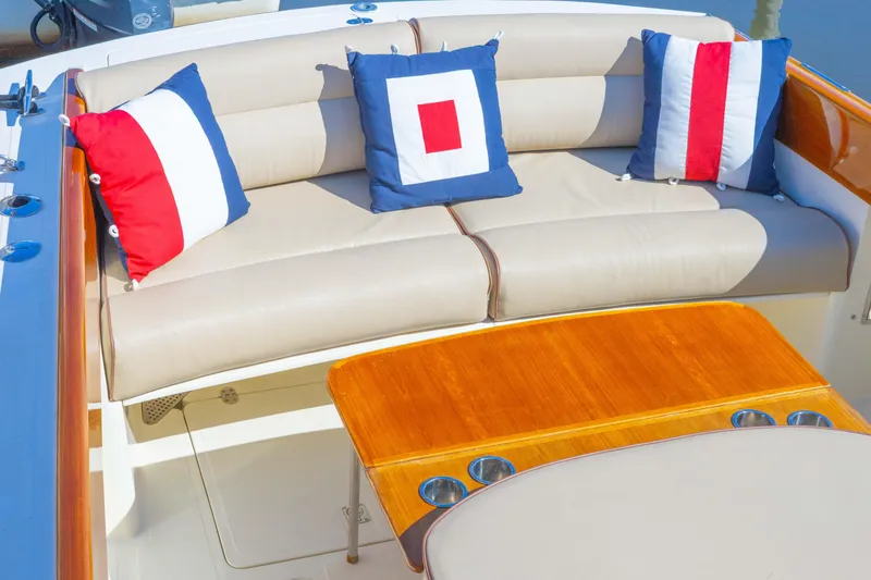 Slide: The Image of 1999 Hinckley Picnic Boat 36 Classic helm with wooden steering wheel and navigation display. - 13