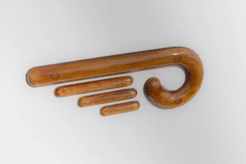 Slide: The Image of 1999 Hinckley Picnic Boat 36 Classic with elegant seating and American flag at marina. - 14