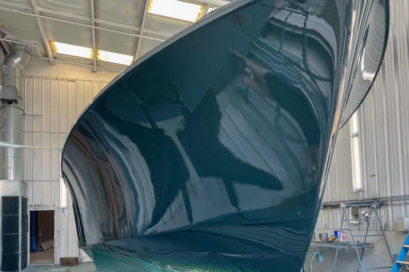 Slide: The Image of Radar and antenna equipment on a 1999 Hinckley Picnic Boat 36 Classic under a blue sky. - 18