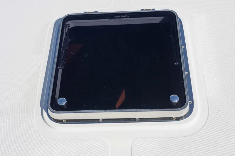 Slide: The Image of Chrome winch and chain on 1999 Hinckley Picnic Boat 36 Classic deck. - 22