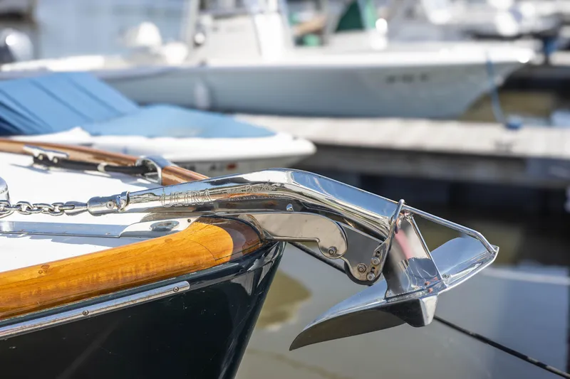 Slide: The Image of Hinckley Picnic Boat 36 Classic 1999, wooden rail detail by dock. - 23