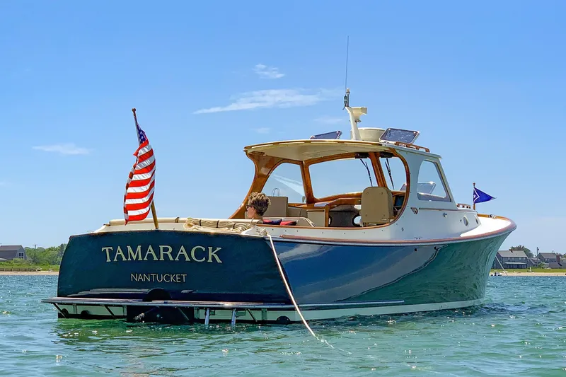 Slide: The Image of 1999 Hinckley Picnic Boat 36 Classic on water, American flag, Nantucket. - 27
