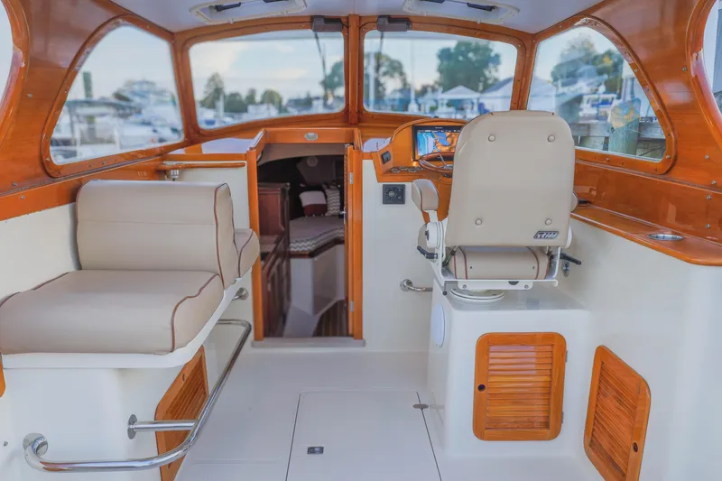 Slide: The Image of Interior of 1999 Hinckley Picnic Boat 36 Classic with wooden helm and navigation system. - 6
