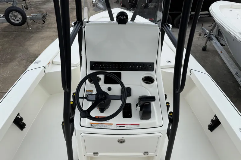Slide: The Image of 2026 Pathfinder 2300 HPS boat console with steering wheel and controls. - 11