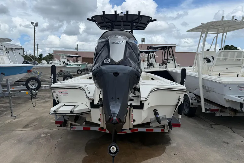Slide: The Image of 2026 Pathfinder 2300 HPS boat with powerful outboard motor, parked on a trailer. - 3
