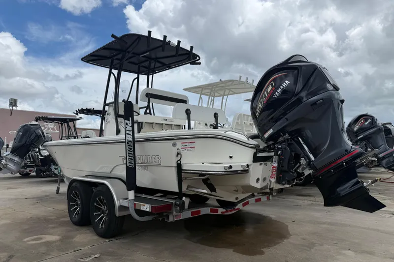 Slide: The Image of 2026 Pathfinder 2300 HPS boat on trailer with Yamaha outboard motor, under cloudy sky. - 5