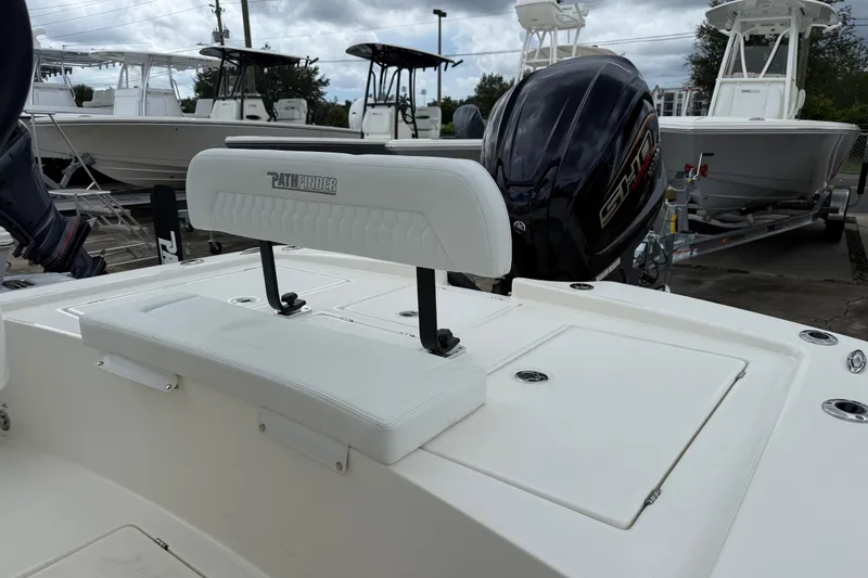 Slide: The Image of 2026 Pathfinder 2300 HPS boat with white seating and powerful outboard motor. - 8