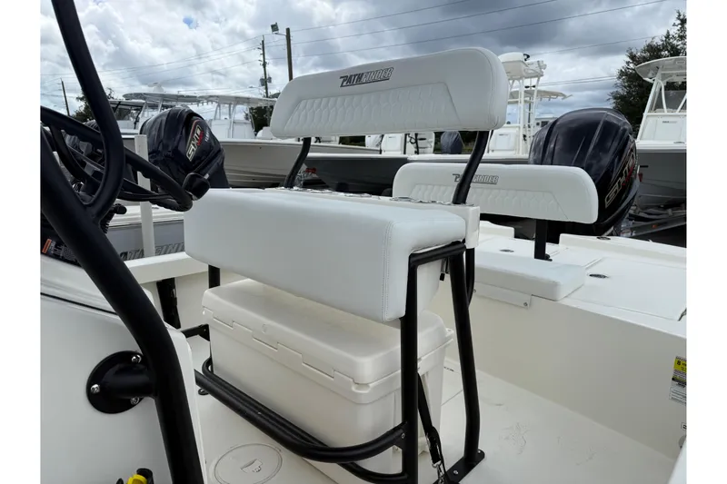 Slide: The Image of 2026 Pathfinder 2300 HPS boat interior with seating and storage, featuring sleek design and powerful engines. - 9