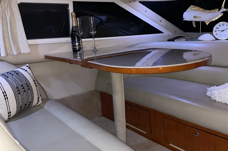 Slide: The Image of Luxurious interior of 2000 Sea Ray 400 Sedan Bridge yacht with elegant seating and decor. - 10