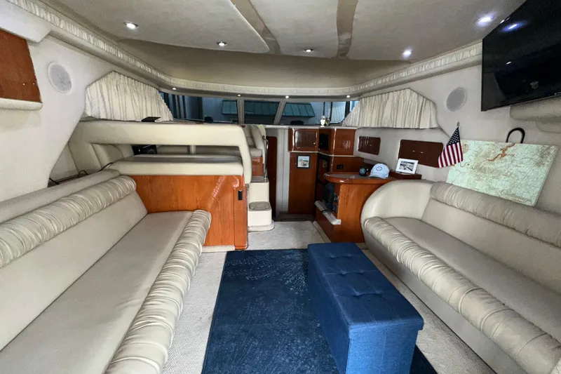 Slide: The Image of Interior of 2000 Sea Ray 400 Sedan Bridge yacht with plush seating and elegant decor. - 16
