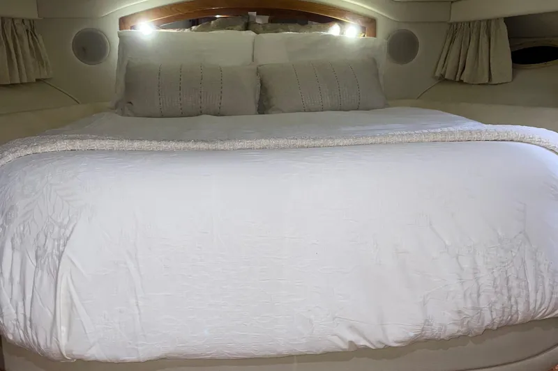 Slide: The Image of Luxurious bedroom interior of 2000 Sea Ray 400 Sedan Bridge yacht. - 17
