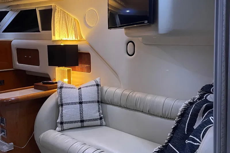 Slide: The Image of 2000 Sea Ray 400 Sedan Bridge yacht docked under a covered marina. - 6