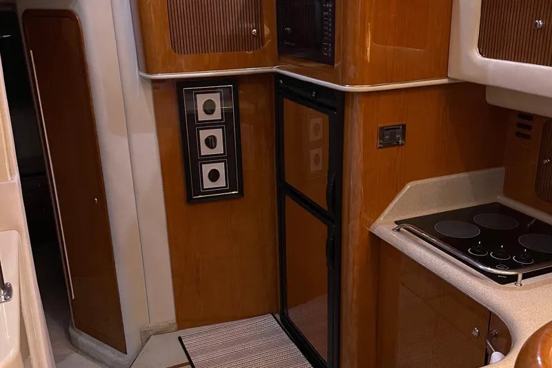 Slide: The Image of 2000 Sea Ray 400 Sedan Bridge yacht docked in marina, rear view. - 7