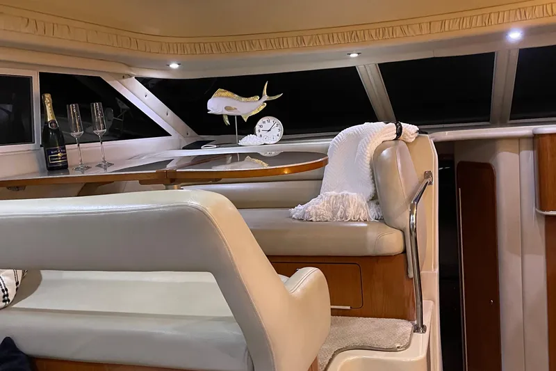 Slide: The Image of Luxurious interior of a 2000 Sea Ray 400 Sedan Bridge yacht with elegant lighting and seating. - 9