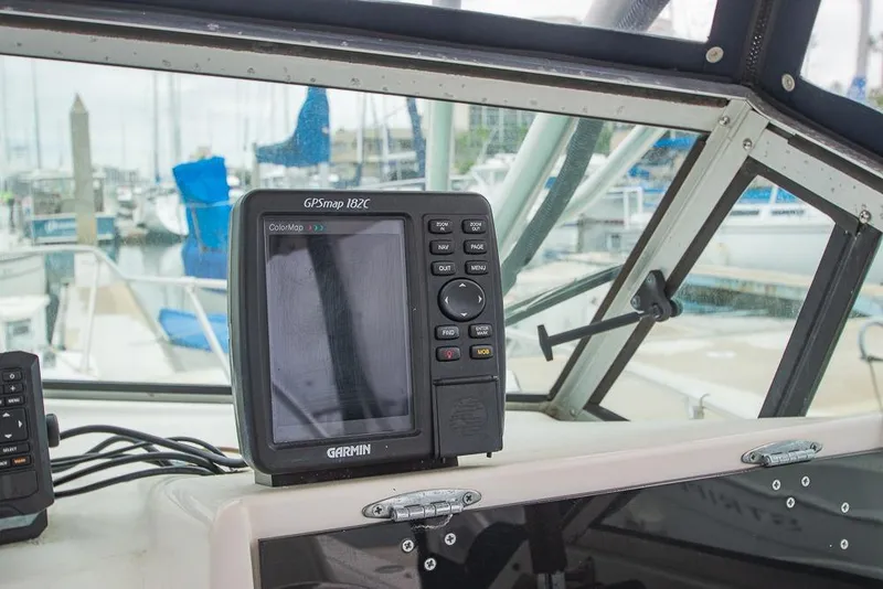 Slide: The Image of Garmin GPSmap 182C on 1990 Grady White SEAFARER boat dashboard at marina. - 11