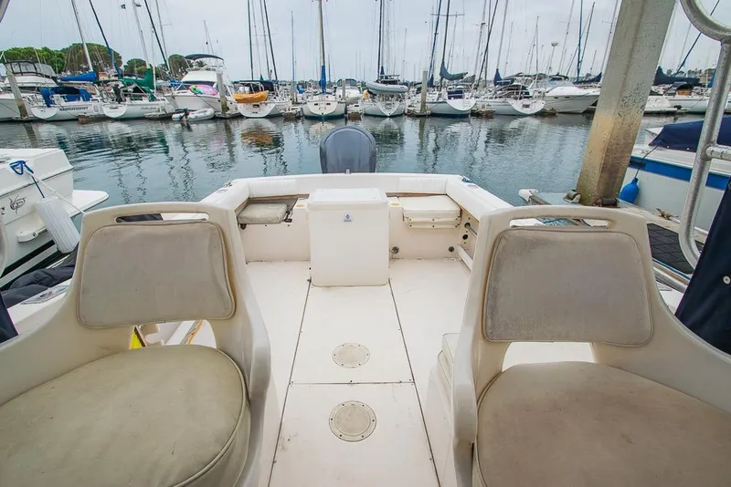 Slide: The Image of 1990 Grady White SEAFARER boat interior at marina with surrounding yachts. - 15