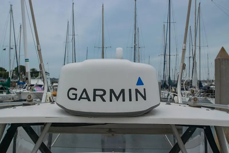 Slide: The Image of 1990 Grady White SEAFARER with Garmin radar, docked in a marina. - 21