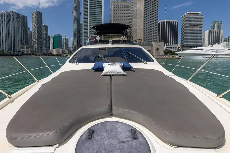 Slide: The Image of 2007 Azimut Fly 62 yacht with sunbathing deck, city skyline in background. - 11