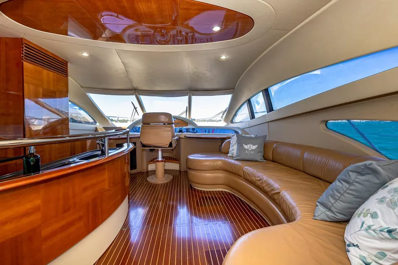 Slide: The Image of Luxurious interior of 2007 Azimut Fly 62 yacht with leather seating and wooden finishes. - 15