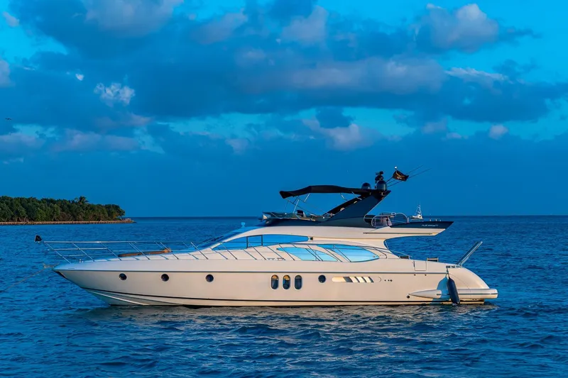 Slide: The Image of 2007 Azimut Fly 62 yacht on calm blue sea under cloudy sky. - 2