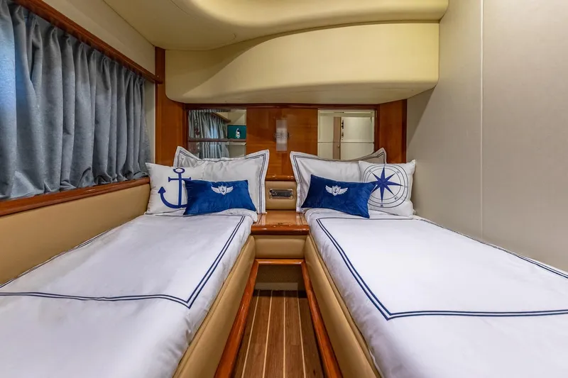 Slide: The Image of Luxurious twin cabin interior on 2007 Azimut Fly 62 yacht with nautical-themed decor. - 27