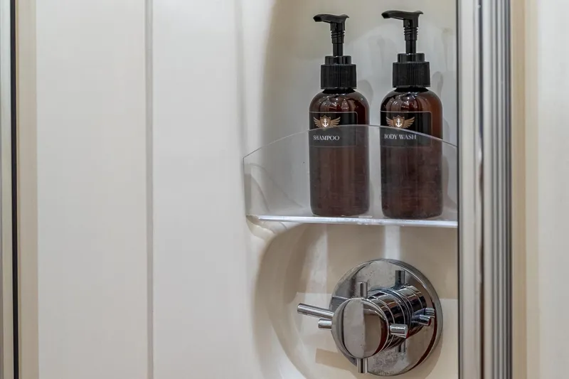 Slide: The Image of Shower amenities in 2007 Azimut Fly 62 yacht bathroom, featuring shampoo and body wash bottles. - 30