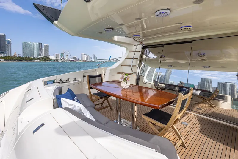 Slide: The Image of Luxurious 2007 Azimut Fly 62 yacht with elegant deck, city skyline view. - 8
