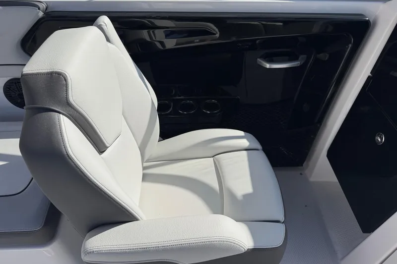Slide: The Image of 2025 Yamaha Boats AR250 interior with sleek, modern seating and black accents. - 15