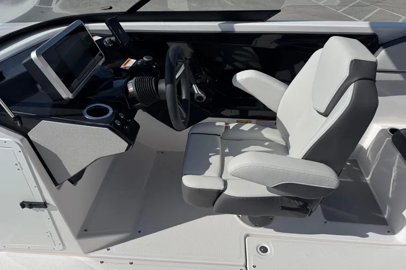 Slide: The Image of 2025 Yamaha Boats AR250 cockpit with modern steering and comfortable seating. - 19