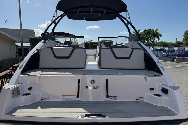Slide: The Image of 2025 Yamaha Boats AR250, rear view, showcasing spacious deck and seating area. - 3