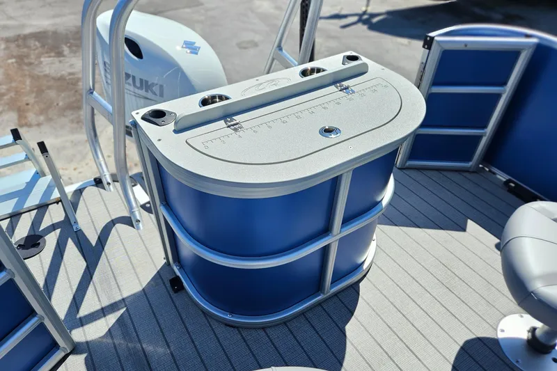 Slide: The Image of 2026 Bentley Pontoons 203 Fish-N-Cruise deck with fishing station and Suzuki engine. - 12