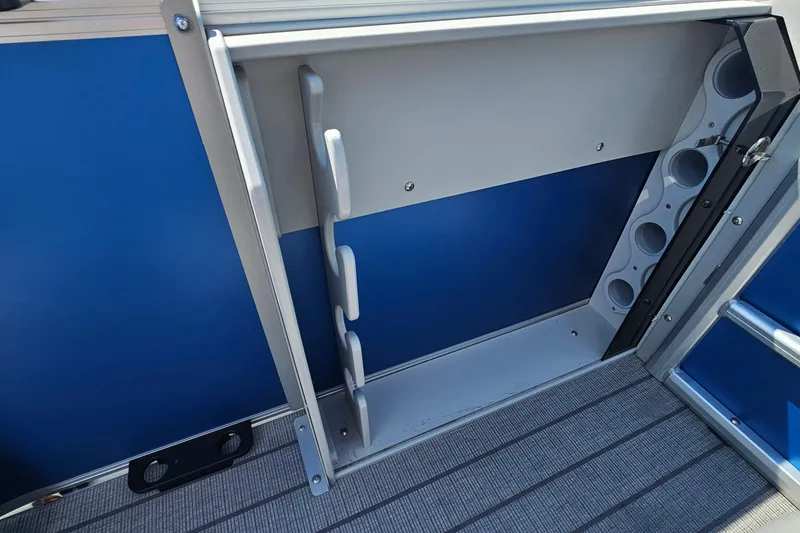 Slide: The Image of 2026 Bentley Pontoons 203 Fish-N-Cruise interior storage compartment with rod holders. - 14
