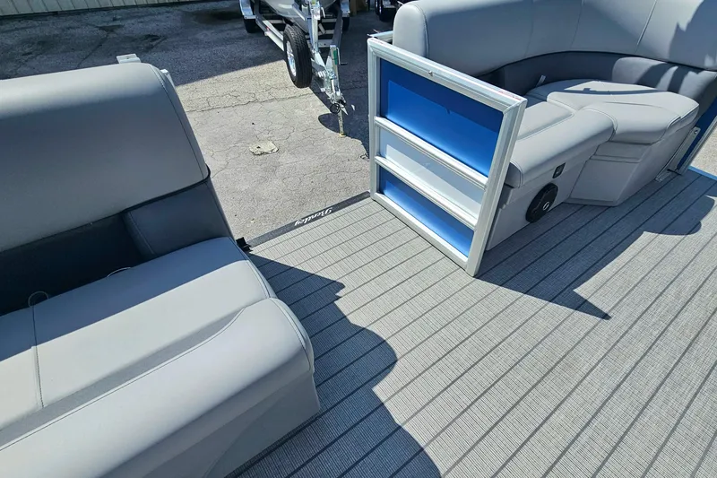 Slide: The Image of 2026 Bentley Pontoons 203 Fish-N-Cruise interior with gray seating and blue accents. - 18