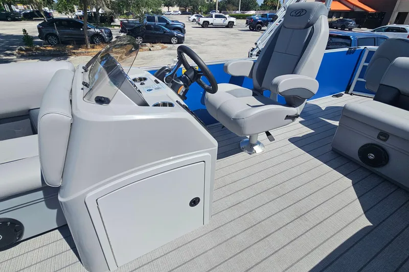 Slide: The Image of 2026 Bentley Pontoons 203 Fish-N-Cruise interior with captain's chair and control console. - 19