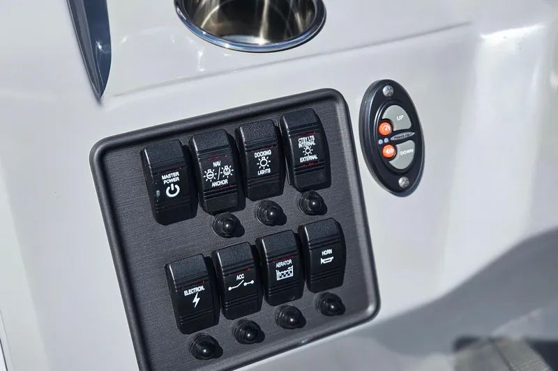 Slide: The Image of Control panel of 2026 Bentley Pontoons 203 Fish-N-Cruise with various switches and buttons. - 21