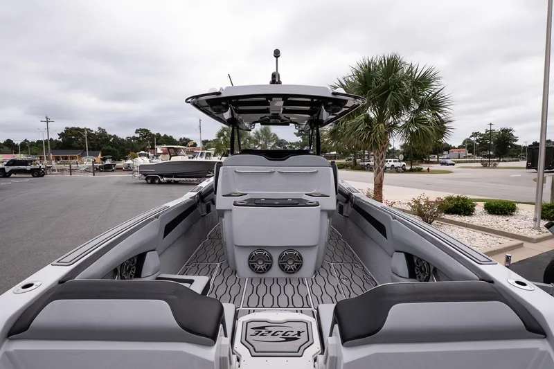Slide: The Image of 2024 Sunsation 32 CCX boat interior with modern seating and sleek design. - 10