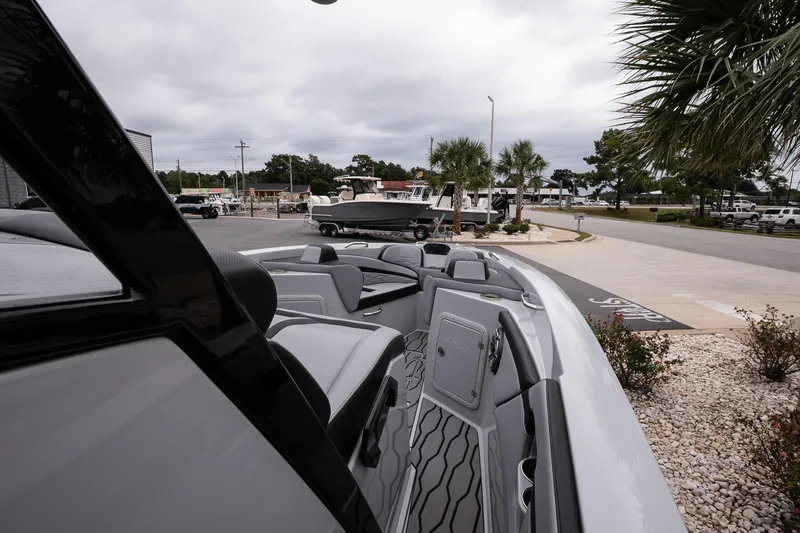 Slide: The Image of 2024 Sunsation 32 CCX boat interior with modern seating and sleek design. - 15