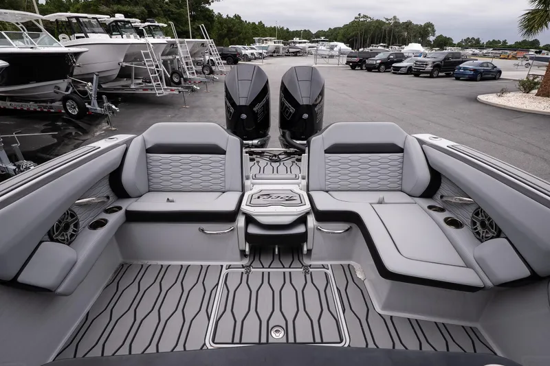 Slide: The Image of 2024 Sunsation 32 CCX boat interior with sleek seating and dual outboard motors. - 8