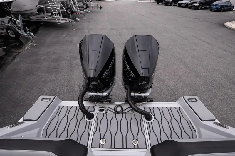 Slide: The Image of 2024 Sunsation 32 CCX boat with dual outboard engines on a trailer. - 9